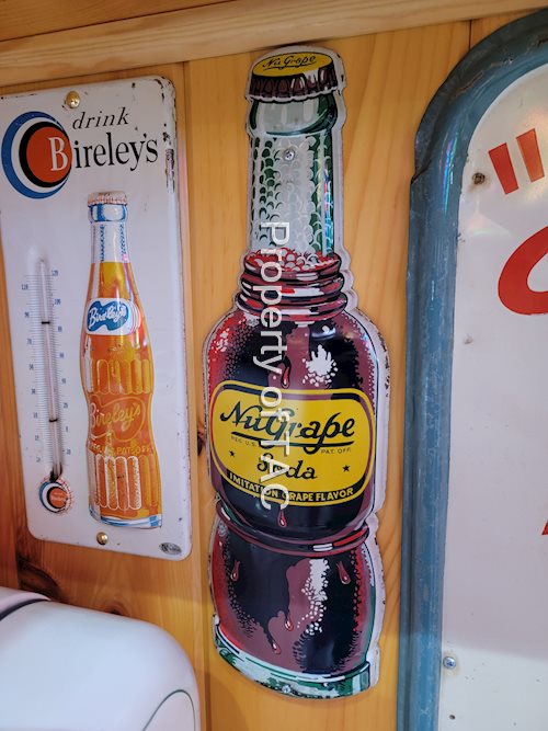 NuGrape Soda Bottle Shaped Metal Sign