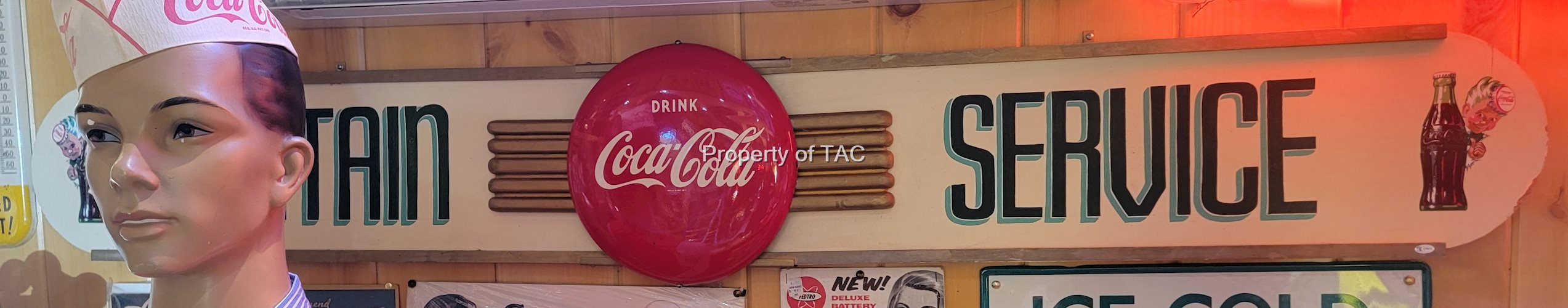 Drink Coca-Cola Metal Button mounted on a Fountain Service Masonite Sign